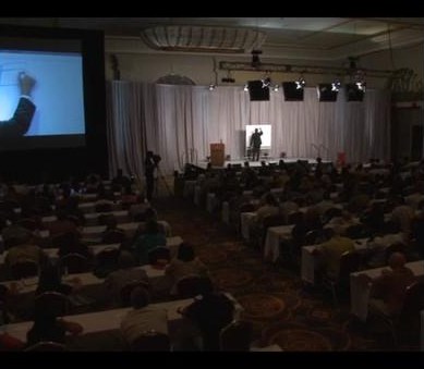 Jimmy speaking to a full room